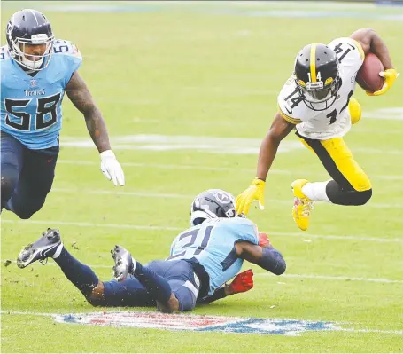  ?? STEVE ROBERTS / USA TODAY SPORTS ?? Tennessee Titans cornerback Malcolm Butler tackles Pittsburgh Steelers wide receiver Ray-ray Mccloud during the second half at Nissan Stadium on Sunday. The Steelers jumped out to a big lead by the third quarter and then hung on to beat the Titans, 27-24.