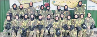  ?? ?? Girls U14 paintballi­ng recently with their mentors.