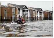  ?? JOE RAEDLE / GETTY IMAGES ?? A Jetski is used to help people evacuate homes on Sunday in Houston. Tropical Storm Harvey is expected to dump upward to 40 inches of rain in Texas over the next couple of days.