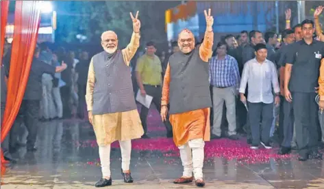  ?? MONEY SHARMA/AFP ?? ■ PM Narendra Modi and Amit Shah celebratin­g the BJP’s victory in the general elections, in New Delhi on May 23, 2019