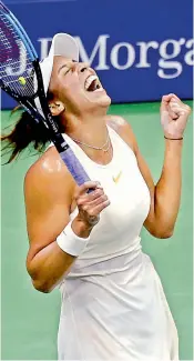  ?? — AP ?? Madison Keys of the USA reacts after defeating Carla Suarez Navarro in the US Open quarterfin­als.