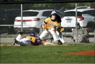  ?? PAUL DICICCO — FOR THE NEWS-HERALD ?? Berkshire’s Blake Jenkins dives back into first as Kirtland’s Gage Sullivan awaits the throw May 11.