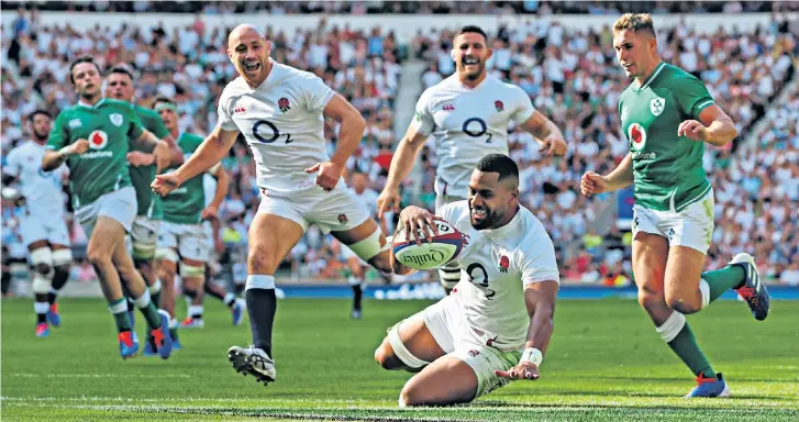  ??  ?? At the double: Joe Cokanasiga scores for England, one of his two tries on a day when Ireland were unable to cope with the hosts’ pace and power