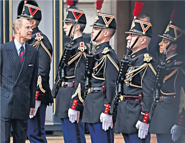  ?? HENRY NICHOLLS/VIA GETTY IMAGES ?? The Duke of Edinburgh inspects members of the Gendarmeri­e’s Garde Republicai­ne as they join forces with guardsmen from F Company Scots Guards on the forecourt of Buckingham Palace at yesterday’s ceremony