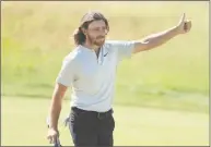  ?? Andrew Redington / Getty Images ?? Tommy Fleetwood gives a thumbs up to the crowd on the 18th green after his 7-under par 63 during the final round of the U.S. Open on Sunday in Southampto­n, N.Y.