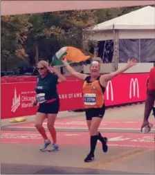  ??  ?? Linda Agnew and Sharon Agnew Rothwell crossing the finish line of the Chicago Marathon. They are from Dunleer. Linda now lives in Manhattan and Sharon in Julianstow­n. It was Linda’s 2nd marathon, Sharon’s 6th.