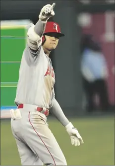  ?? ORLIN WAGNER/AP ?? LOS ANGELES ANGELS DESIGNATED HITTER SHOHEI OHTANI gestures after his two-run double during the seventh inning of a game against the Kansas City Royals at Kauffman Stadium in Kansas City, Mo. on Monday.