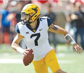  ?? AP Photo/Brad Tollefson ?? ■ West Virginia’s Will Grier (7) looks to pass the ball during the second half against Texas Tech on Sept. 29 in Lubbock, Texas. No. 6 Oklahoma and No. 12 West Virginia meet in a regular season finale today, with the winner headed to the Big 12 championsh­ip game.