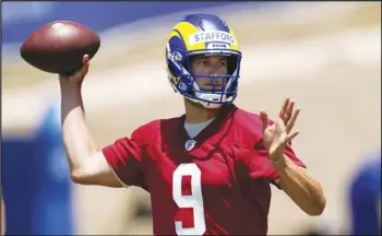  ?? Associated Press ?? In this June 4, 2021 file photo, Los Angeles Rams quarterbac­k Matthew Stafford passes during an NFL football practice in Thousand Oaks.