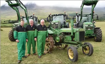  ??  ?? Daniel and Danny Tim O’Sullivan with their John Deere 6135, 6215 and 6130 with Brendan Ferris on his 1928 John Deere launching the Beaufort Threshing Cancer Day which will be held on the 9th September in Beaufort. Photo by Michelle Cooper Galvin