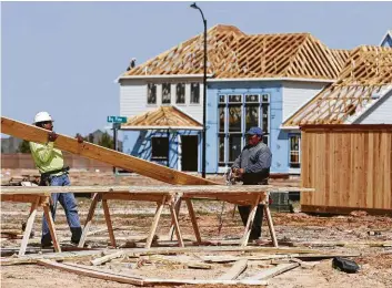  ?? Melissa Phillip photos / Houston Chronicle ?? A house goes up in Parkland Village in the master-planned community of Bridgeland, which is in the Cypress area.