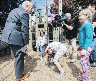  ??  ?? Premier John Horgan joins in at the Quadra Elementary school playground.