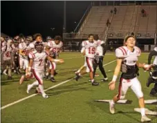  ?? MICHAEL REEVES — FOR DIGITAL FIRST MEDIA ?? Coatesvill­e celebrates the win after Friday’s game.