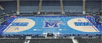  ?? MATTHEW A. SMITH/MEMPHIS ATHLETICS ?? For University of Memphis games at FedExForum, blue tiger imagery covers the court.