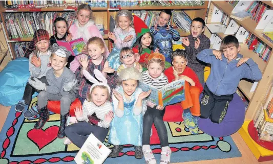  ??  ?? Library Pupils at Kettins Primary School marked Book Week Scotland in a number of ways, including dropping everything to read for ten minutes whenever the bell rang