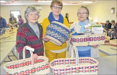  ?? SALLY COLE/THE GUARDIAN ?? Instructor Faye White, centre, and club president Eleanor Laquerre, right, show Rikki Schock some of the work done by members of the Selkirk Millennium Seniors Club at the exhibit/open house at the Belfast Recreation Centre, this past Tuesday. Schock...