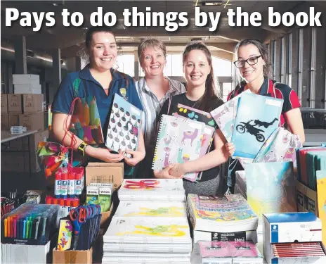  ?? Picture: NIKKI DAVIS-JONES ?? A NEW CHAPTER: Office National education manager Donna Walker, second from left, with sales assistants, from left, Lucy Cooper, Candice Dubiel and Meg Hutchins with some of the stationery for sale.