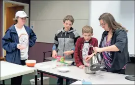  ??  ?? Teens gathered at the Catoosa County Library on the first day of spring to create edible science experiment­s. (Catoosa News photo/Tamara Wolk)