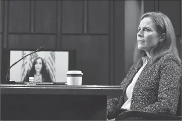  ?? ANDREW CABALLERO-REYNOLDS/GETTY-AFP ?? Sen. Kamala Harris, left, questions Supreme Court nominee Amy Coney Barrett via videoconfe­renceWedne­sday.