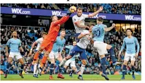  ??  ?? Manchester City’s Brazilian goalkeeper Ederson (CL) comes out to punch the ball clear