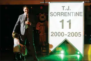  ??  ?? Photo courtesy of Brian Jenkins / UVM Athletics
After leading the St. Raphael boys basketball team to state titles in the late 90s, T.J. Sorrentine went to Vermont and became an all-conference guard. His number 11 was retired Saturday.