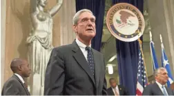  ?? SAUL LOEB/AFP/GETTY IMAGES ?? Justice Department rules require only that special counsel Robert Mueller submit a confidenti­al report when his work is done.