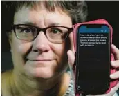  ?? RICK BOWMER/AP ?? Chelle Wyatt of Salt Lake City displays the Otter app on her cellphone. The app, created for business meetings, provides real-time transcript­ions of spoken words.