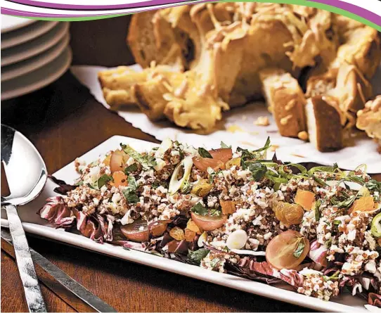  ?? E. JASON WAMBSGANS/CHICAGO TRIBUNE; MARK GRAHAM/FOOD STYLING ?? A colorful salad combines variations of red, from the protein-packed quinoa, to the crunchy radicchio and sweet red grapes, perfect for entertaini­ng from Halloween to Christmas.