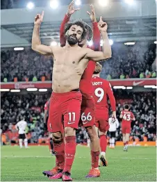  ?? CARL RECINE
Reuters ?? LIVERPOOL’S Mohamed Salah celebrates scoring their sixth goal with Trent Alexander-Arnold. |