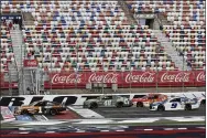  ?? GERRY BROOME — THE ASSOCIATED PRESS ?? Kurt Busch leads the pack as the green flag is waved at the start of the Monster Energy Cup Series race May 24at Charlotte Motor Speedway.