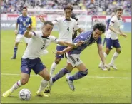  ?? AP photo ?? (left) and Japan's Daichi Kamada fight for the ball during the internatio­nal friendly soccer match between USA and Japan as part of the Kirin Challenge Cup in Duesseldor­f, Germany, on Friday.