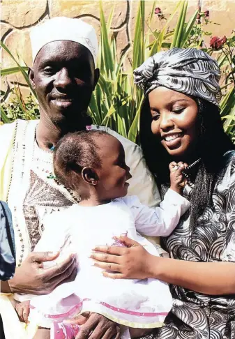  ??  ?? Emmanuel Taban and his bride Motheo with their daughter Naledi on their wedding day in October 2011.