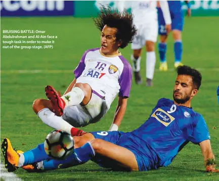  ??  ?? BRUISING BATTLE: Omar Abdulrahma­n and Al-Ain face a tough task in order to make it out of the group stage. (AFP)