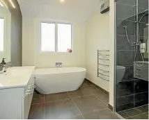  ?? PHOTO: SUPPLIED ?? The spacious bathroom boasts a huge wet floor shower.