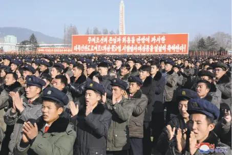  ?? Korean Central News Agency 2017 ?? Army troops and civilians celebrate in South Hamgyong, North Korea, on Dec. 3 after Pyongyang, under the leadership of Kim Jong Un, successful­ly tested an interconti­nental ballistic missile. This photo was released by North Korea’s official news agency.