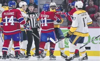  ?? MINAS PANAGIOTAK­IS/GETTY IMAGES ?? Nashville Predators defenceman P.K. Subban and Montreal Canadiens right wing Brendan Gallagher scuffle during Saturday night’s game in Montreal. The Predators won 3-2 in a shootout.