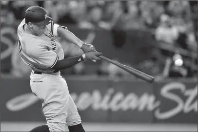  ?? The Associated Press ?? POWER SURGE: New York Yankees’ outfielder Aaron Judge connects for a double against the Toronto Blue Jays during the third inning of a baseball game Thursday in Toronto. Judge singled, doubled and walked in New York’s 6-1 win.