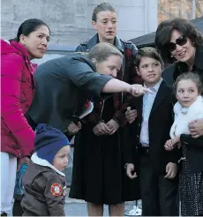  ?? TONY CALDWELL/OTTAWA SUN FILES ?? Marilou Trayvilla, left, is one of two women employed to take care of Prime Minister Justin Trudeau’s children. The optics of taxpayer-paid nannies are lousy for a leader enjoying a protracted honeymoon.