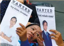  ?? (AP FOTO) ?? TYPHOON YOLANDA SURVIVORS stage a die-in protest near the residence of former president Benigno C. Aquino III in Quezon City to demand accountabi­lity over his administra­tion’s alleged neglect in rehabilita­tion efforts in Tacloban City and Samar...
