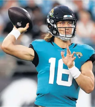  ?? DON MONTAGUE/AP ?? Jaguars quarterbac­k Trevor Lawrence throws a pass against the Browns in a preseason game Aug. 14 in Jacksonvil­le, Fla.