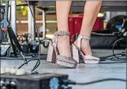  ??  ?? Caitlyn Smith, an American singer-songwriter and musician, reflects one of the style trends seen at ACL Fest and elsewhere this year in her footwear onstage: glitter.