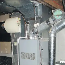  ?? CANSTOCK ?? It’s not unusual for furnace humidifier­s to make homes too moist in winter. The beige, cylindrica­l object toward the left of the furnace is the humidifier with its controls.