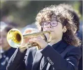  ?? ?? West High student Zion Rodgers plays taps.