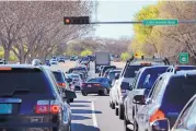  ?? JIM THOMPSON/JOURNAL ?? Traffic is backed up on Alameda Boulevard and Rio Grande as it heads toward the West Side. Proposed reconstruc­tion from the Interstate 25 frontage road west to Edith would expand Alameda to six lanes.