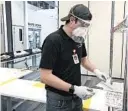  ?? TOYOTA ?? Kirk Barber prepares a shipment of face shields at the Toyota factory in Georgetown, Kentucky.