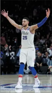  ?? CHRIS SZAGOLA — THE ASSOCIATED PRESS ?? Philadelph­ia 76ers’ Ben Simmons reacts to his assist during the second half in Game 5 of a first-round NBA basketball playoff series against the Miami Heat, Tuesday.