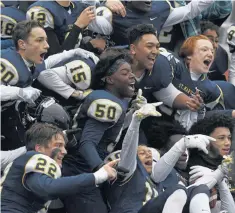  ?? MICHAEL CORRADO / BOSTON HERALD ?? CHEERING SECTION: St. Mary’s celebrates after earning a trip to the Super Bowl.