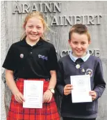  ??  ?? Lochaline primary school winners Floriana Lawrance and Archie Kennedy, who both won first prize in their solo singing competitio­n. 21_ F26 Ardnamurch­an MOD 9_ Archie Kennedy&Floriana Lawrance