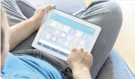  ?? PHOTO: GETTY IMAGES ?? Source of entry . . . A man uses his Apple iPad to operate the Smart Home home automation app to control appliances and other devices in his home.