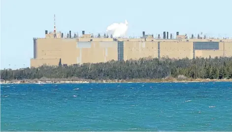  ?? MIKE HENSEN/POSTMEDIA NETWORK ?? The Bruce nuclear plant, privately-operated but Ontario-owned, looms large on the Lake Huron shoreline. Ontario Power Generation wants to build a deepburial site near the plant to sink low- and intermedia­te-level waste from Ontario’s three nuclear...
